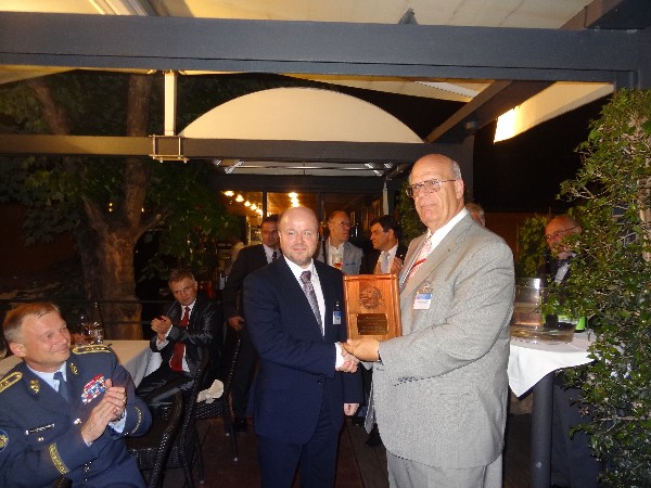 In May, Kent Schneider (r), president and chief executive officer of AFCEA International, presents an engraved plaque to Petr Jirasek (c), a member of AFCEA's Executive Committee, for his contribution and service to the Czech Chapter, while Gen. Vlastimil Picek, CZA, chief of the General Staff of the Czech Armed Forces, looks on.